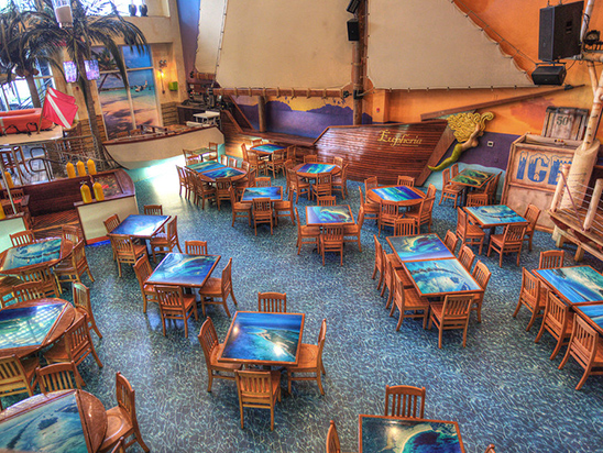 Main Floor interior with wooden chairs and tables